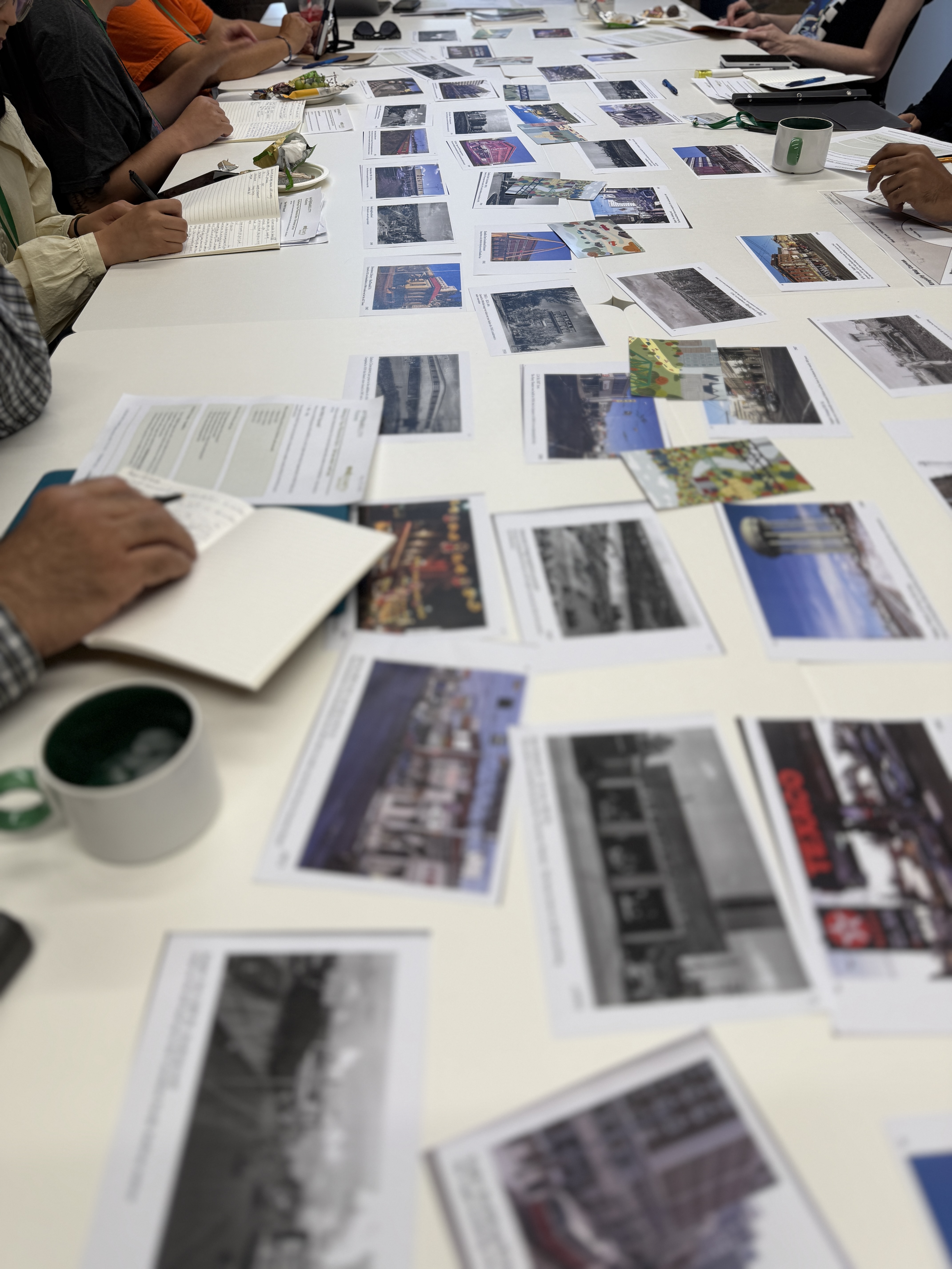 Photovoice creators reviewing photographs together